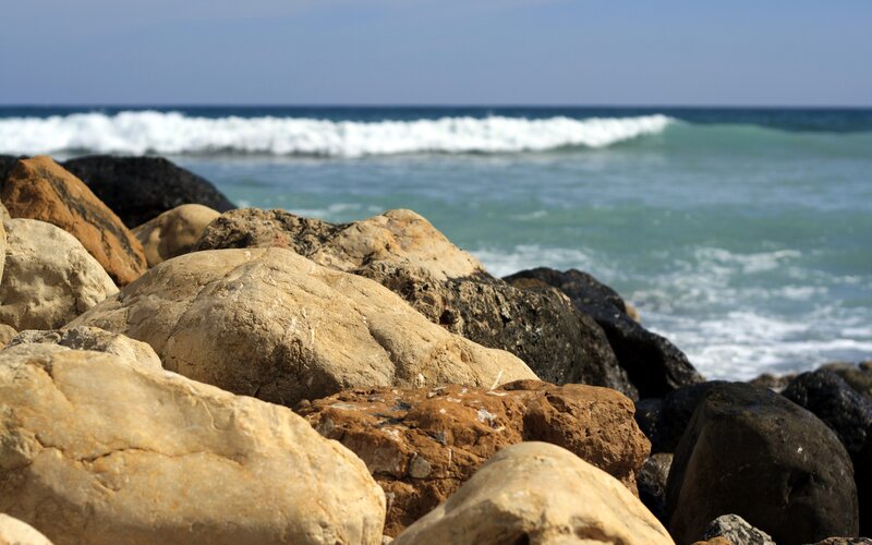 Rocks on a beach with ocean waves