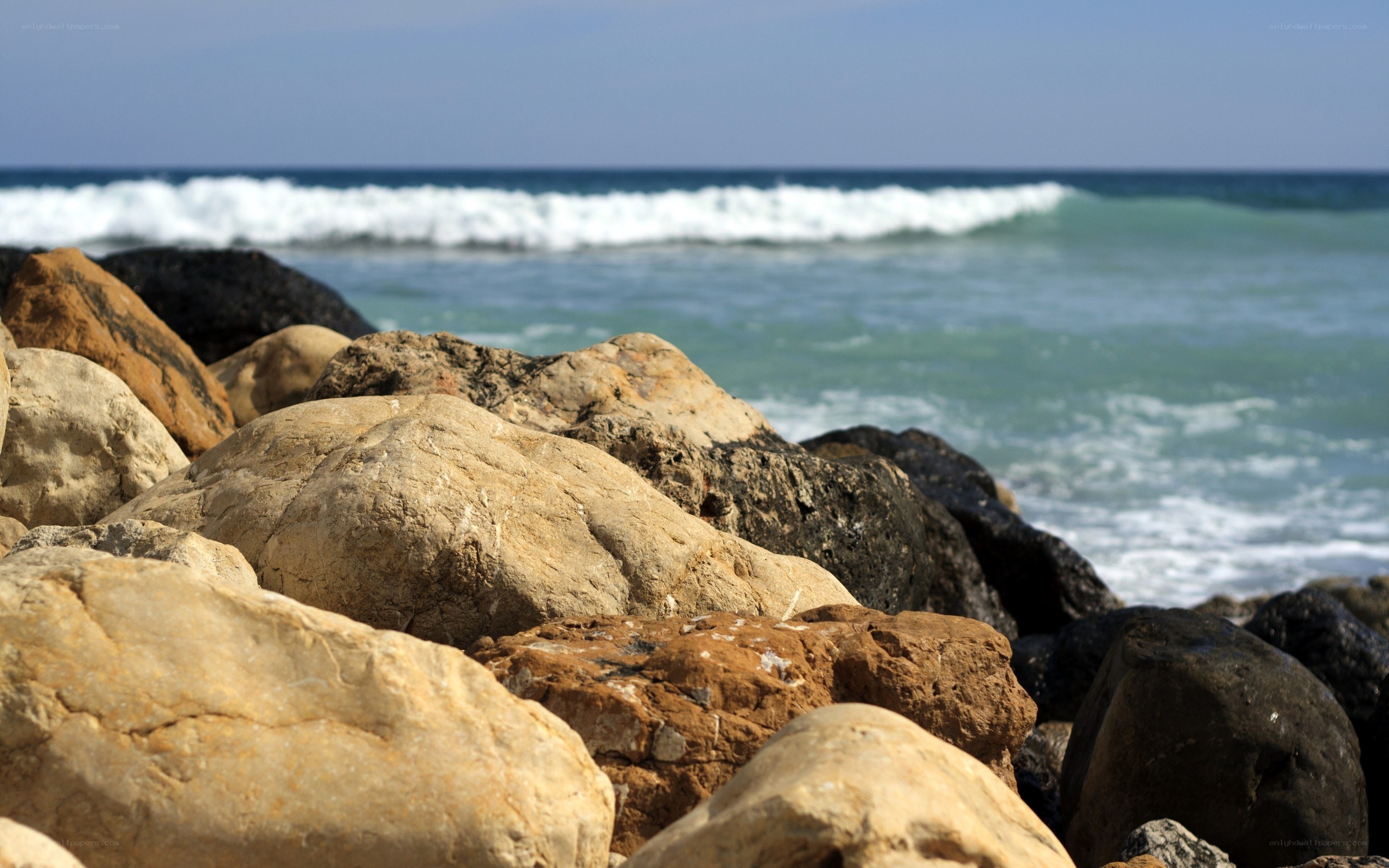 Rocks on a beach with ocean waves