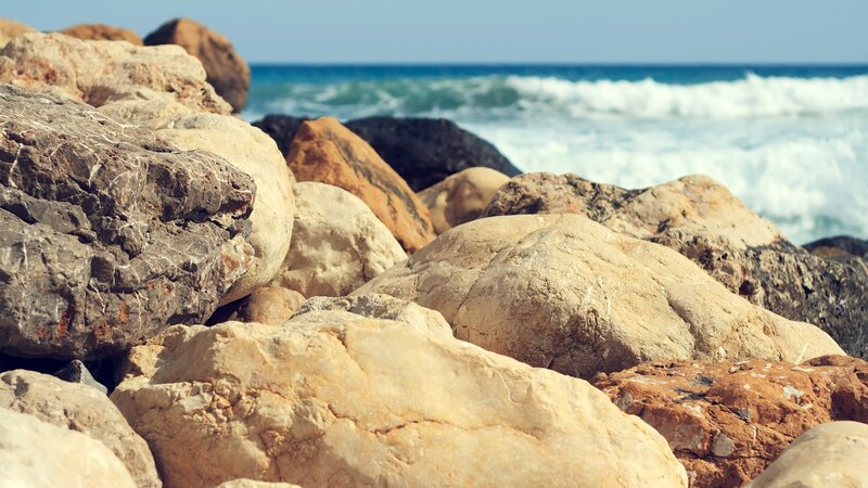 Rocks on a beach with ocean waves