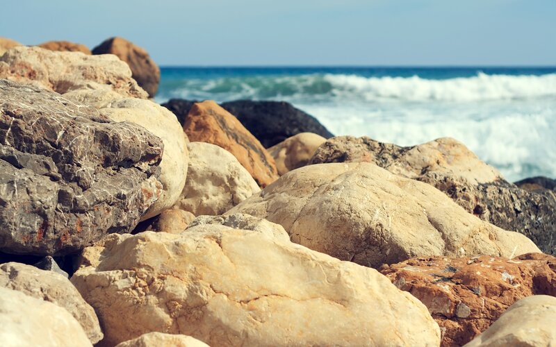 Rocks on a beach with ocean waves