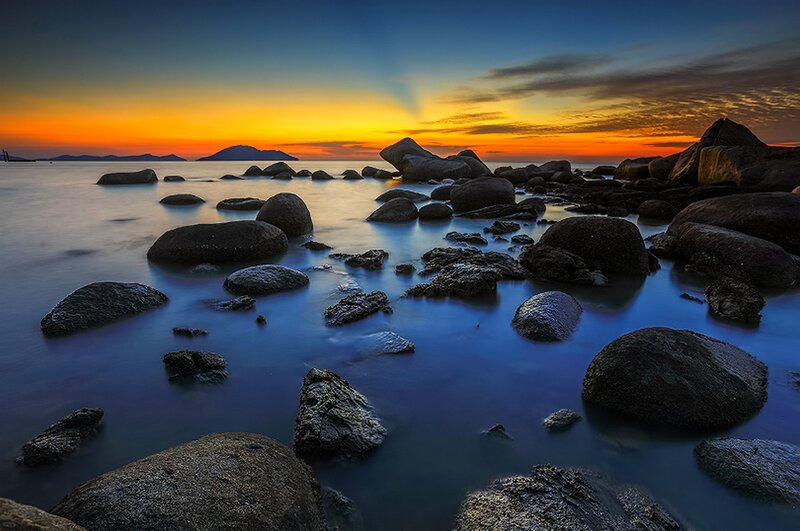 Rocks on Beach at Sunset — Blue, Serene, Photograph, Ocean, Sky, Island
