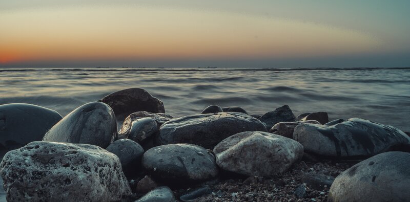 Rocks on Beach at Sunset — Gray, Serene, Photograph