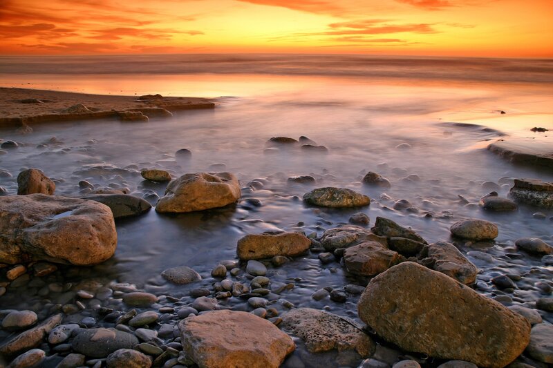Rocks on Beach at Sunset — Orange, Serene, Photograph, Ocean, Sky, Sand, Yellow