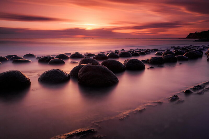 Rocks on Beach at Sunset — Purple, Serene, Photograph, Ocean, Sky, Cliff