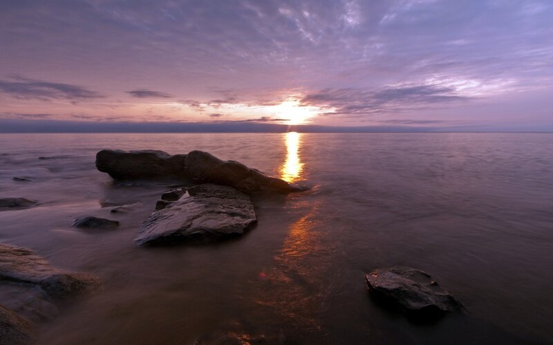 Rocks on Beach at Sunset — Purple, Serene, Photograph, Sun, Ocean, Clouds, Orange