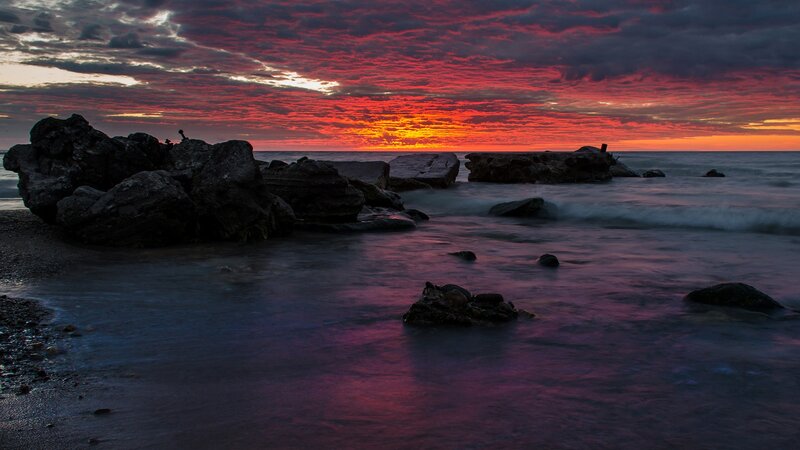 Rocks on Beach at Sunset — Red, Dramatic, Photograph, Ocean, Sky, Clouds, Purple