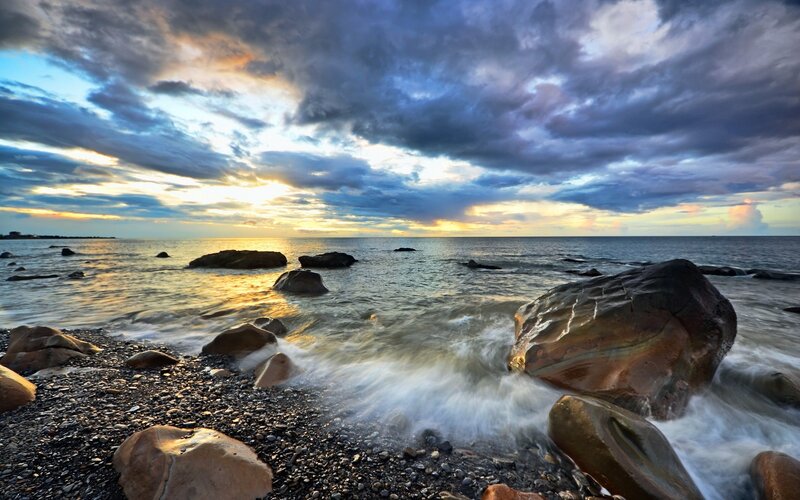 Rocks on Pebble Beach — Blue, Dramatic, Sunset, Photograph, Ocean, Sky