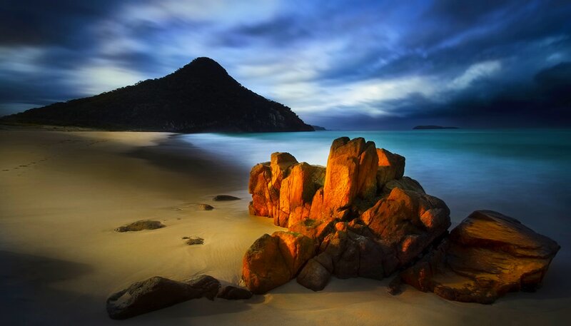 Rocks on Sandy Beach — Blue, Dramatic, Sunset