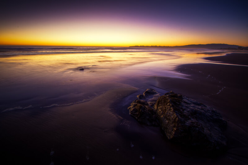 Rocks on Wet Beach — Purple, Serene