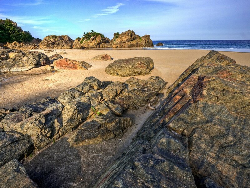 Rocky Beach at Coast — Blue, Serene, Afternoon, Photograph, Rocks