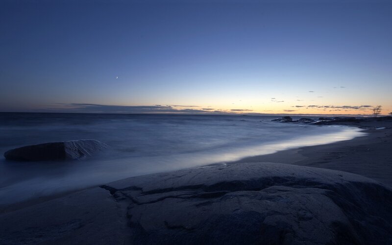 Rocky Beach at Dusk — Blue, Serene, Photograph, Moon, Ocean, Sand
