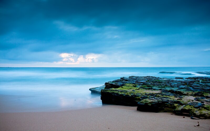 Rocky Beach at Dusk — Blue, Serene, Photograph