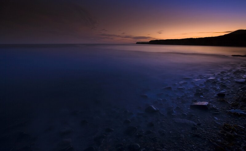 Rocky Beach at Dusk — Purple, Serene, Sunset, Photograph, Ocean, Sky, Cliff