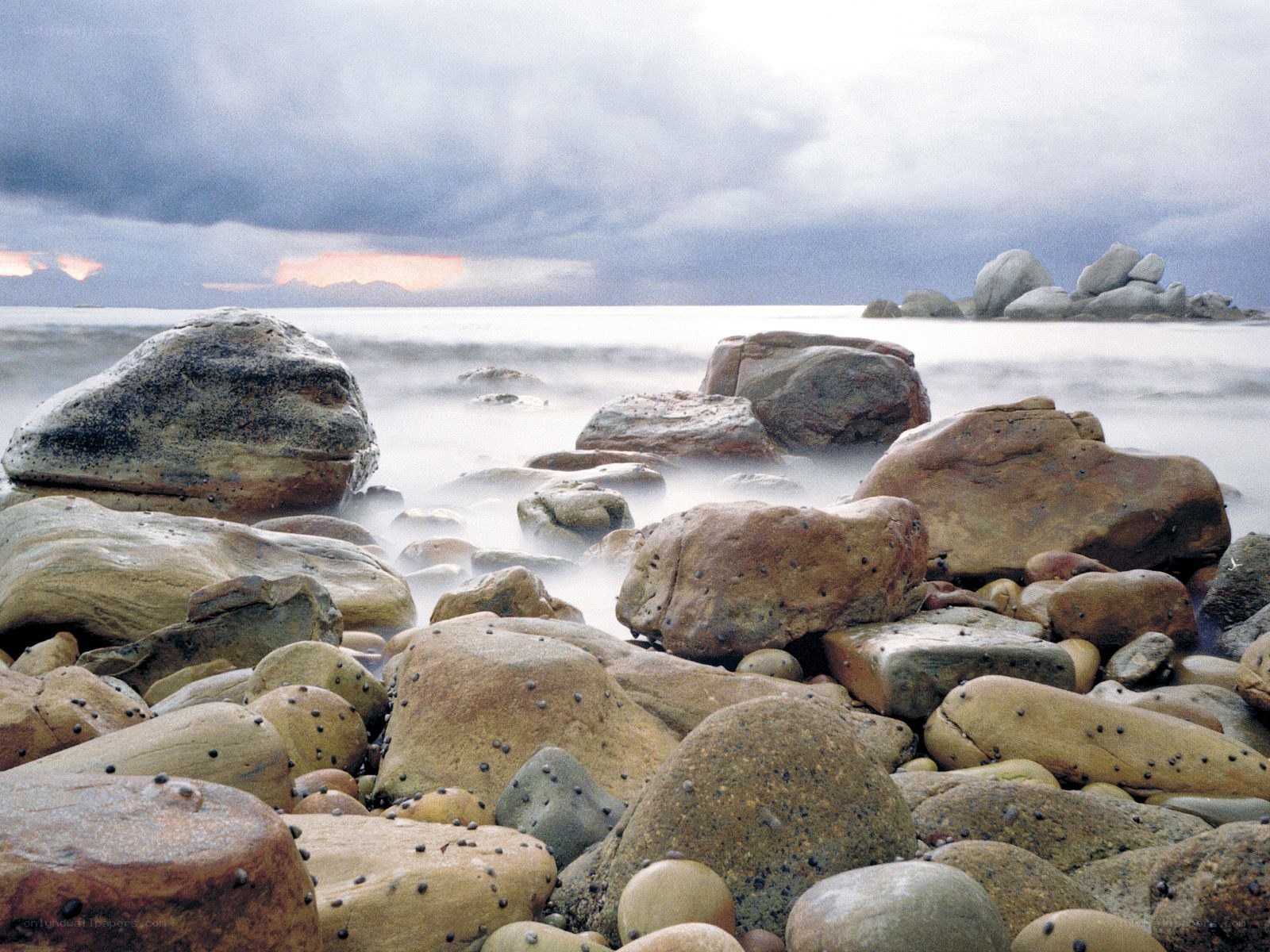 Rocky beach at sunset
