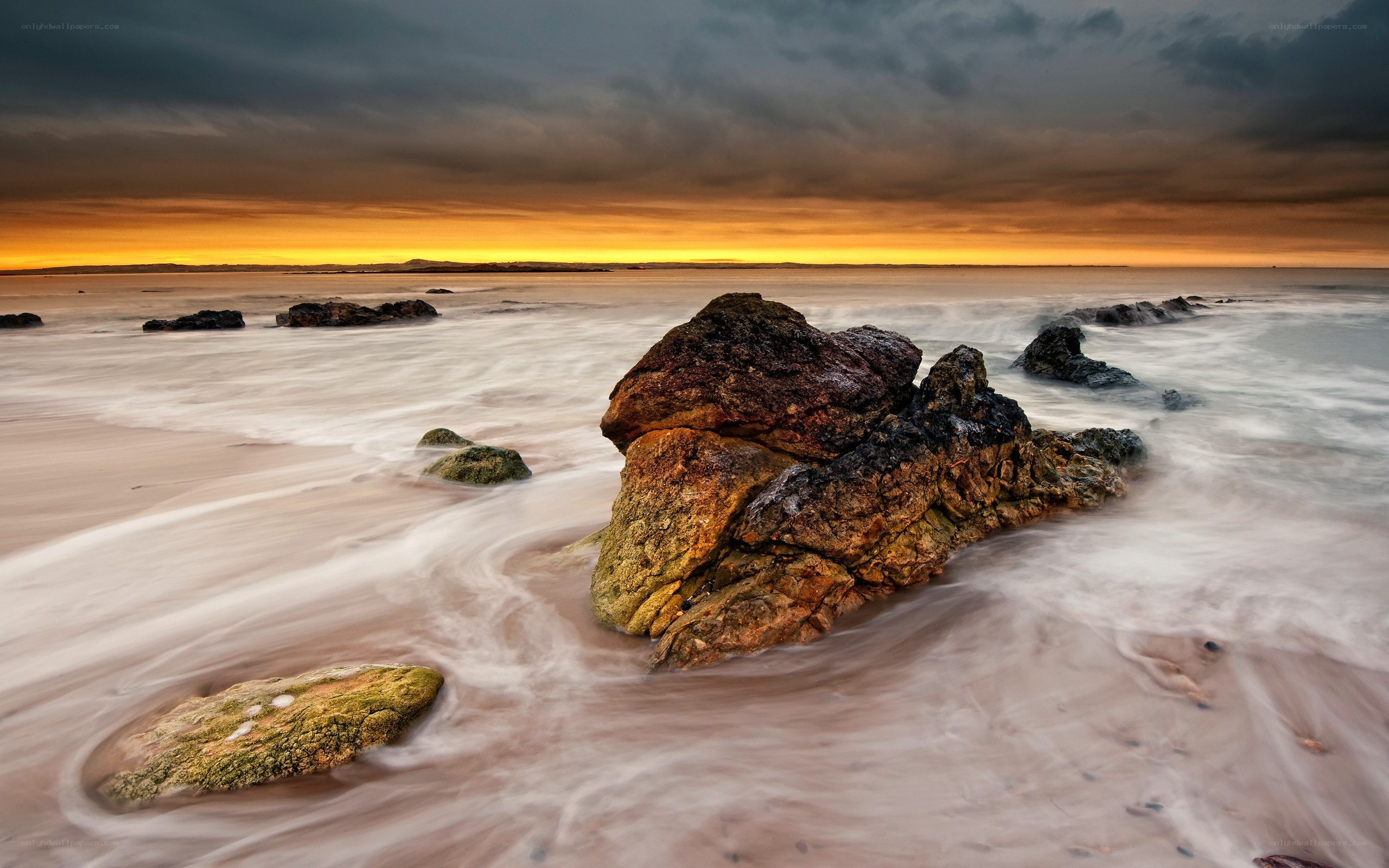 Rocky beach at sunset