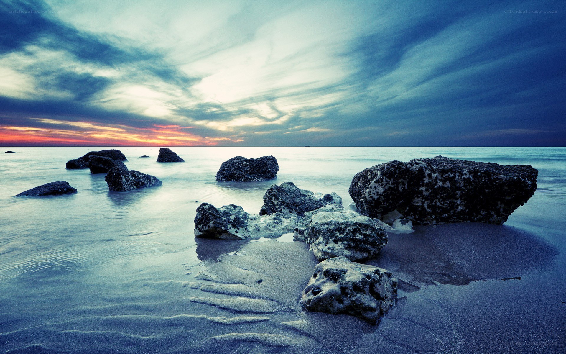 Rocky beach at sunset