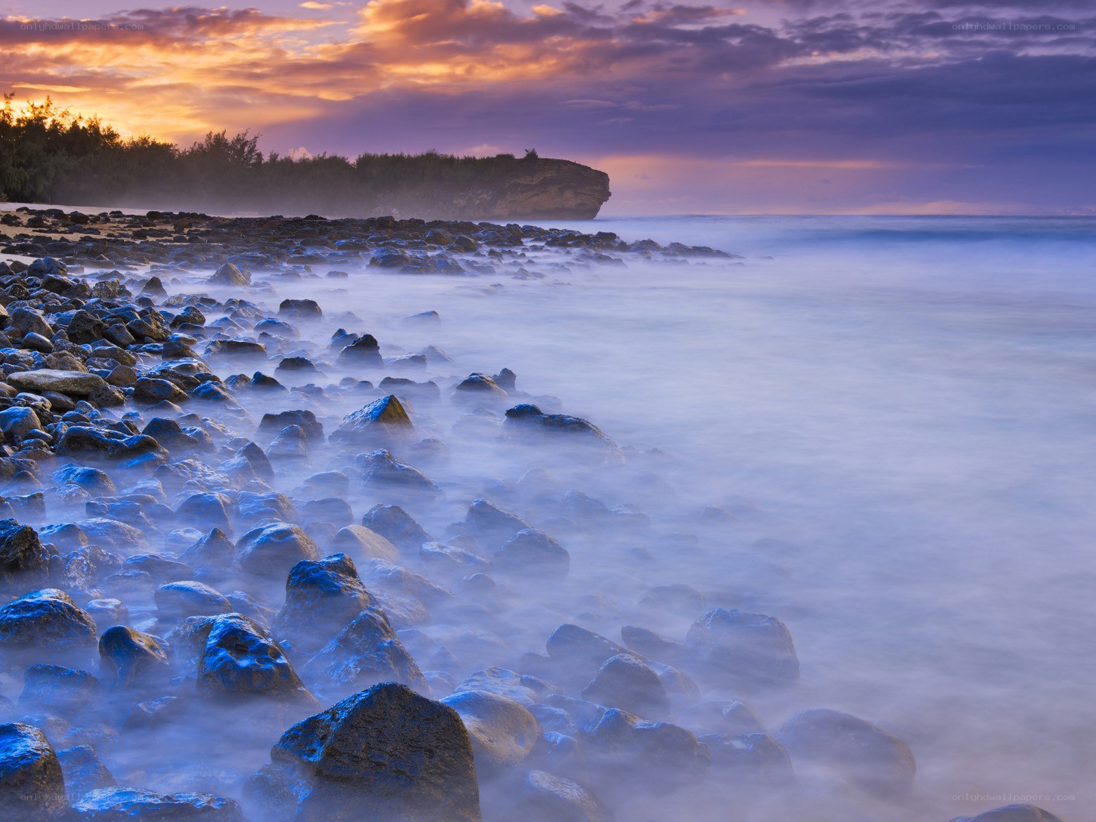 Rocky beach at sunset