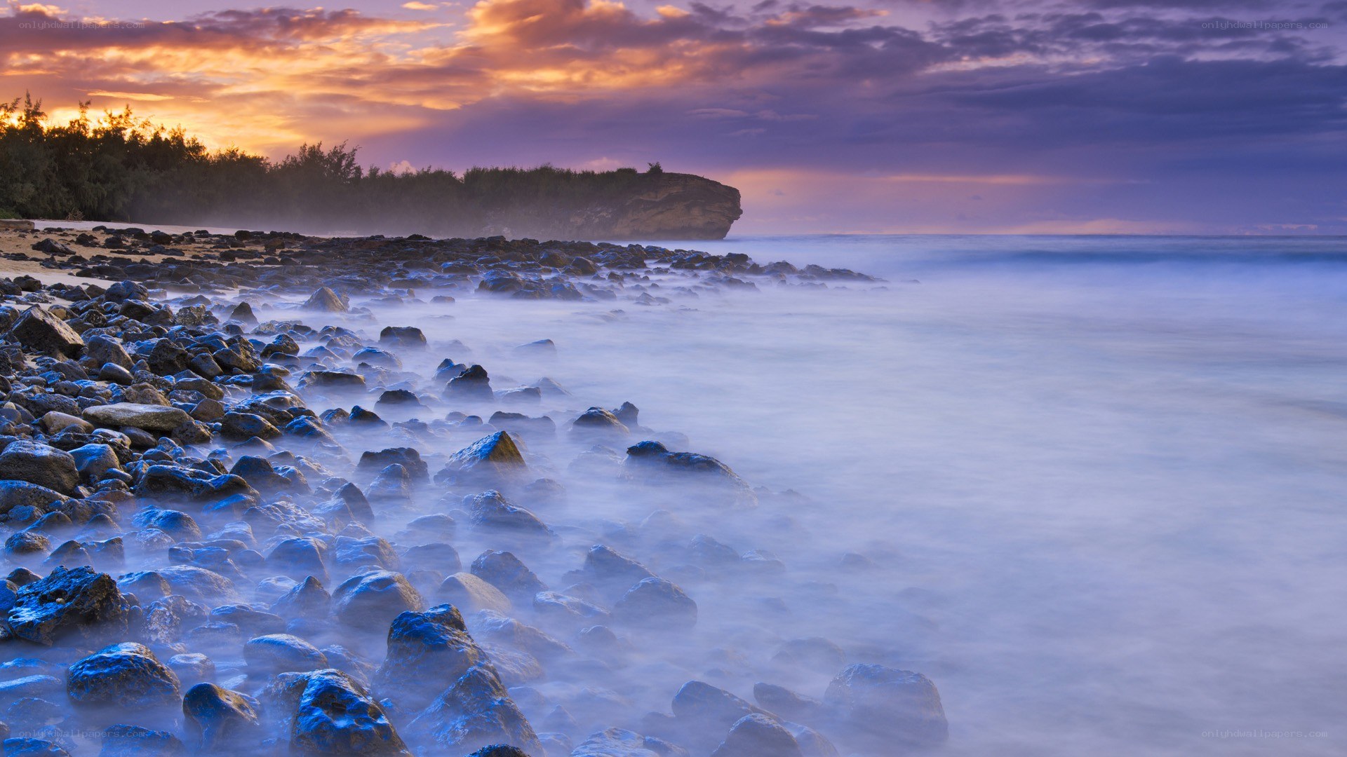 Rocky beach at sunset
