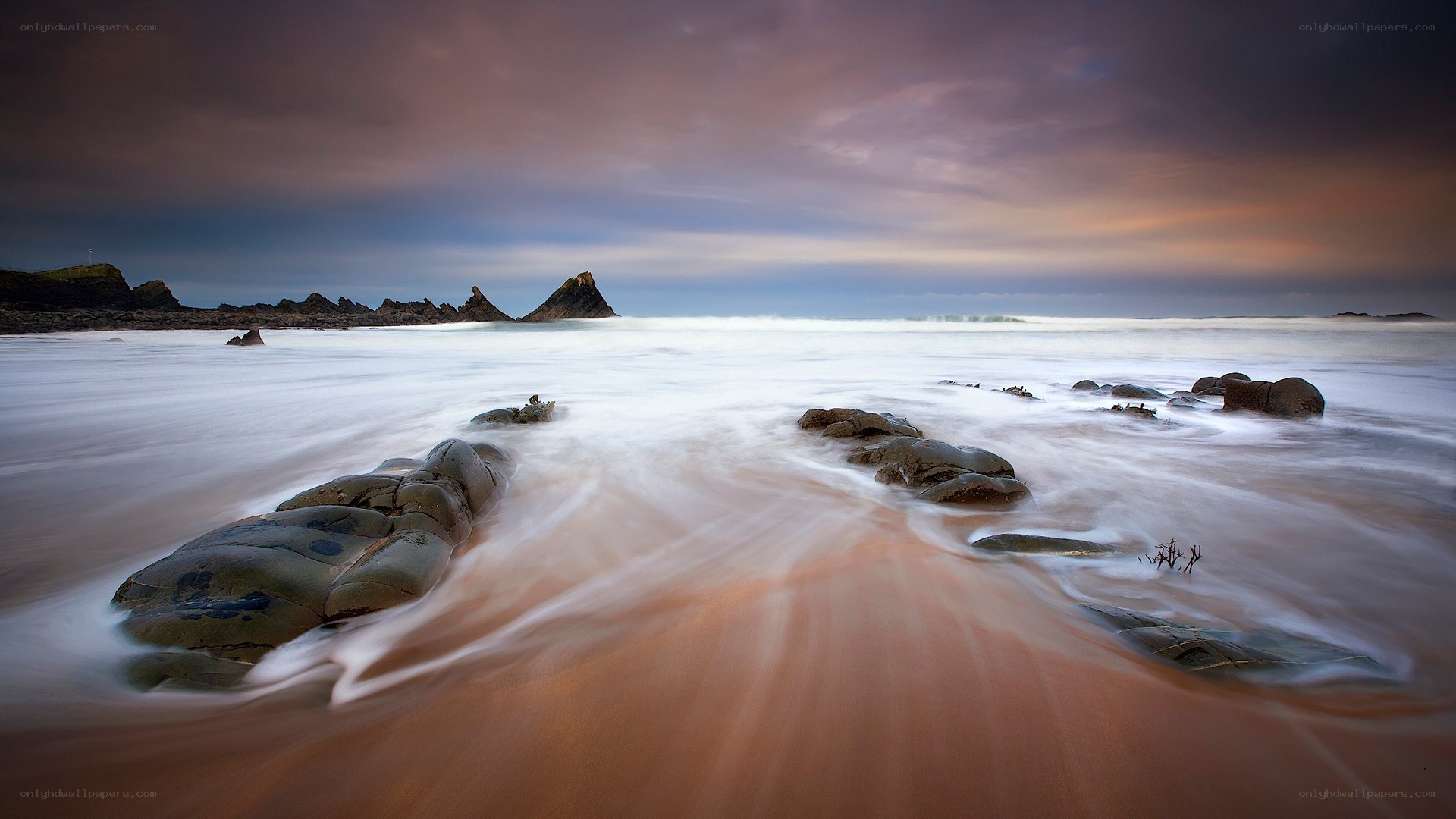 Rocky beach at sunset