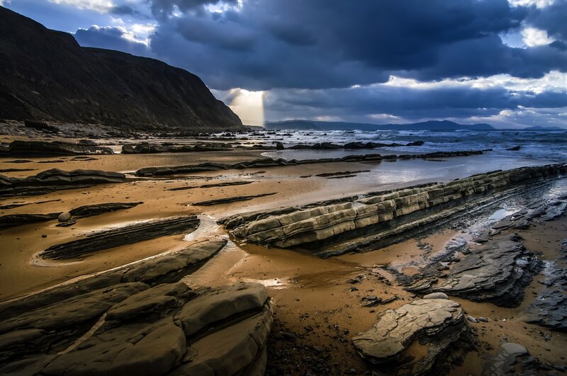 Rocky Beach at Sunset — Blue, Dramatic, Photograph, Mountain