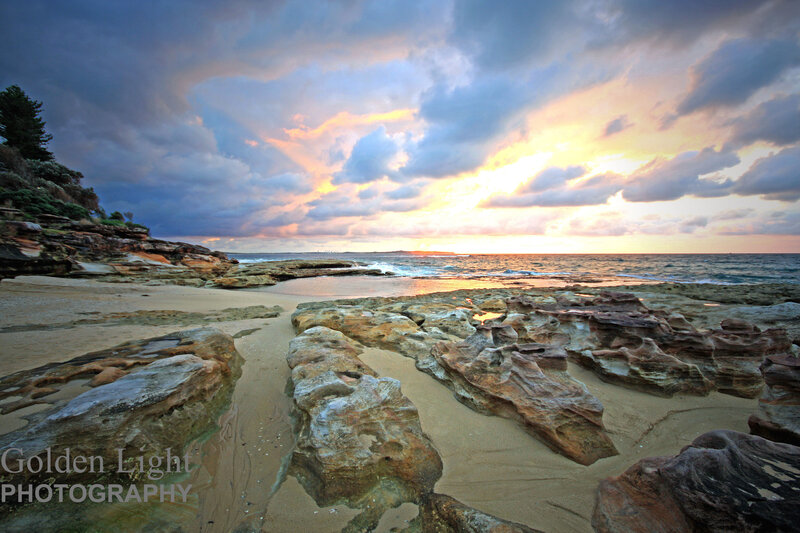 Rocky Beach at Sunset — Blue, Dramatic, Photograph, Ocean, Clouds, Sand, Orange, Brown