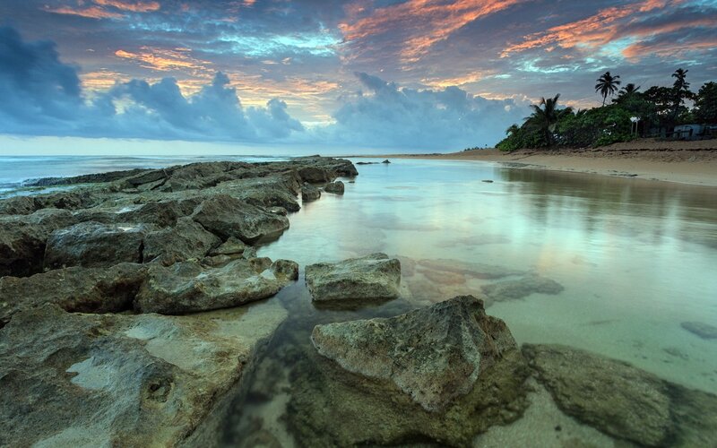 Rocky Beach at Sunset — Blue, Dramatic, Photograph, Ocean, Palm Trees, Clouds