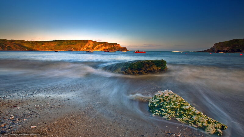 Rocky Beach at Sunset — Blue, Serene, Photograph, Rocks, Boats