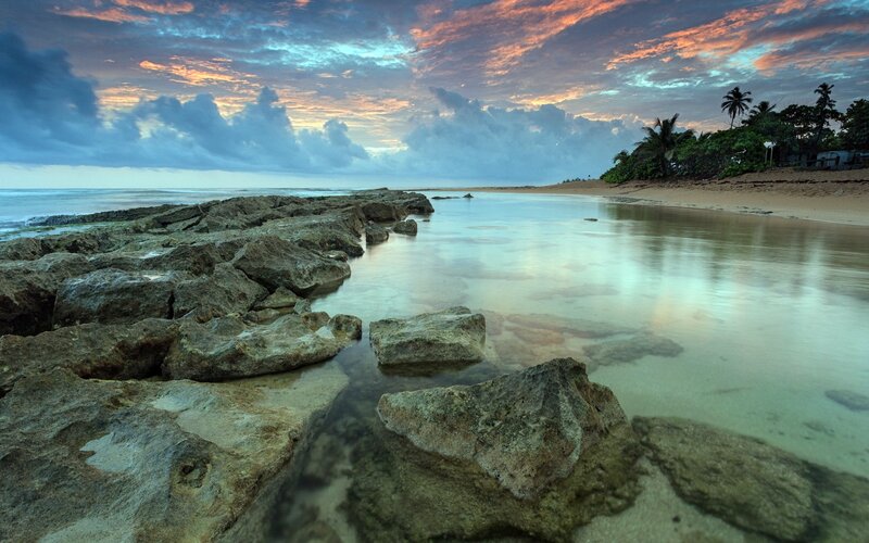 Rocky Beach at Sunset — Blue, Serene, Photograph, Rocks, Ocean, Palm Trees