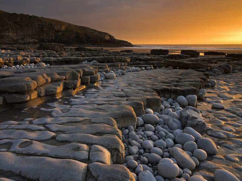 Rocky Beach at Sunset — Orange, Serene, Photograph, Cliffs, Ocean, Pebbles