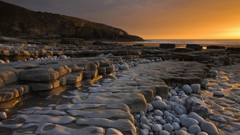 Rocky Beach at Sunset — Orange, Serene, Photograph, Cliffs, Ocean, Rocks