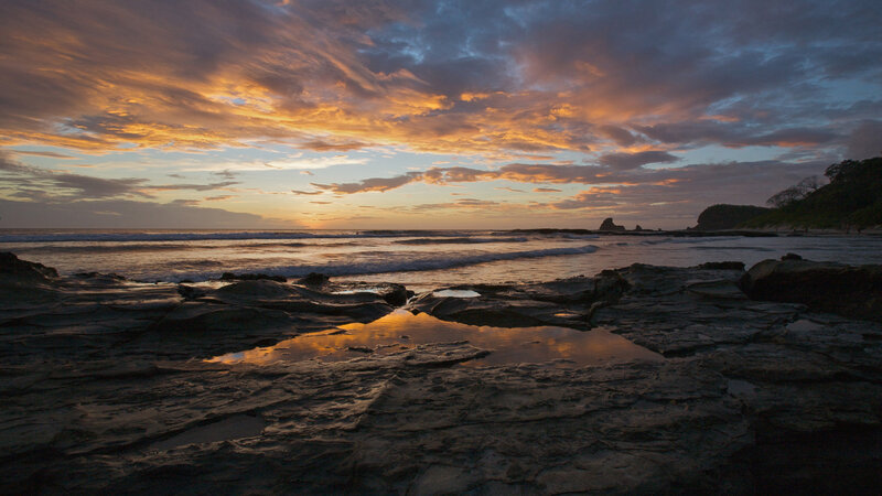 Rocky Beach at Sunset — Orange, Serene, Photograph, Ocean, Clouds, Rocks, Blue
