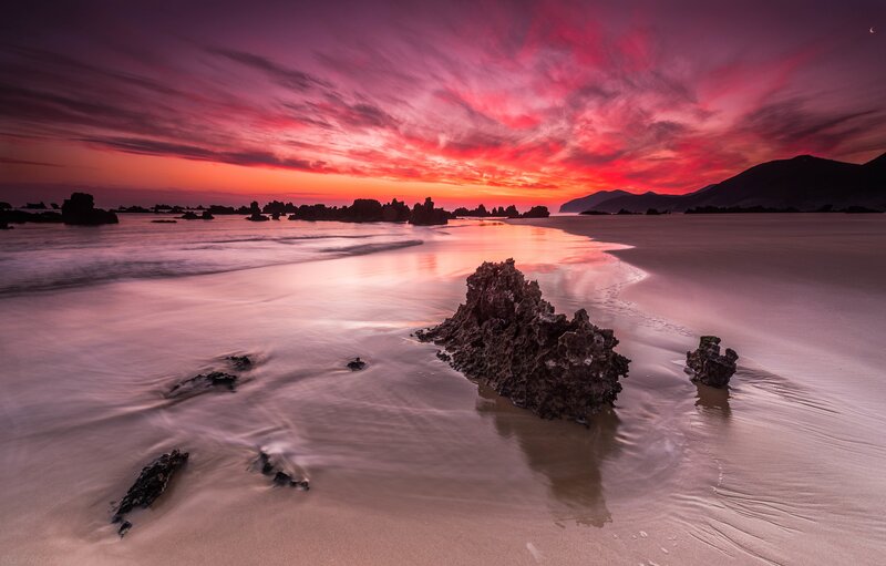 Rocky Beach at Sunset — Red, Dramatic, Photograph, Rocks, Sand