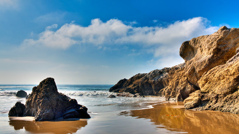 Rocky beach under blue sky