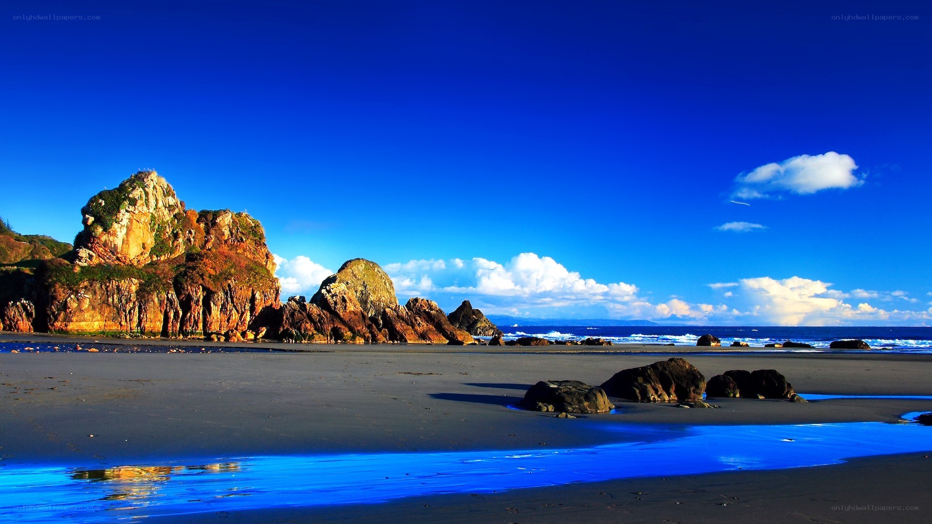 Rocky beach under blue sky