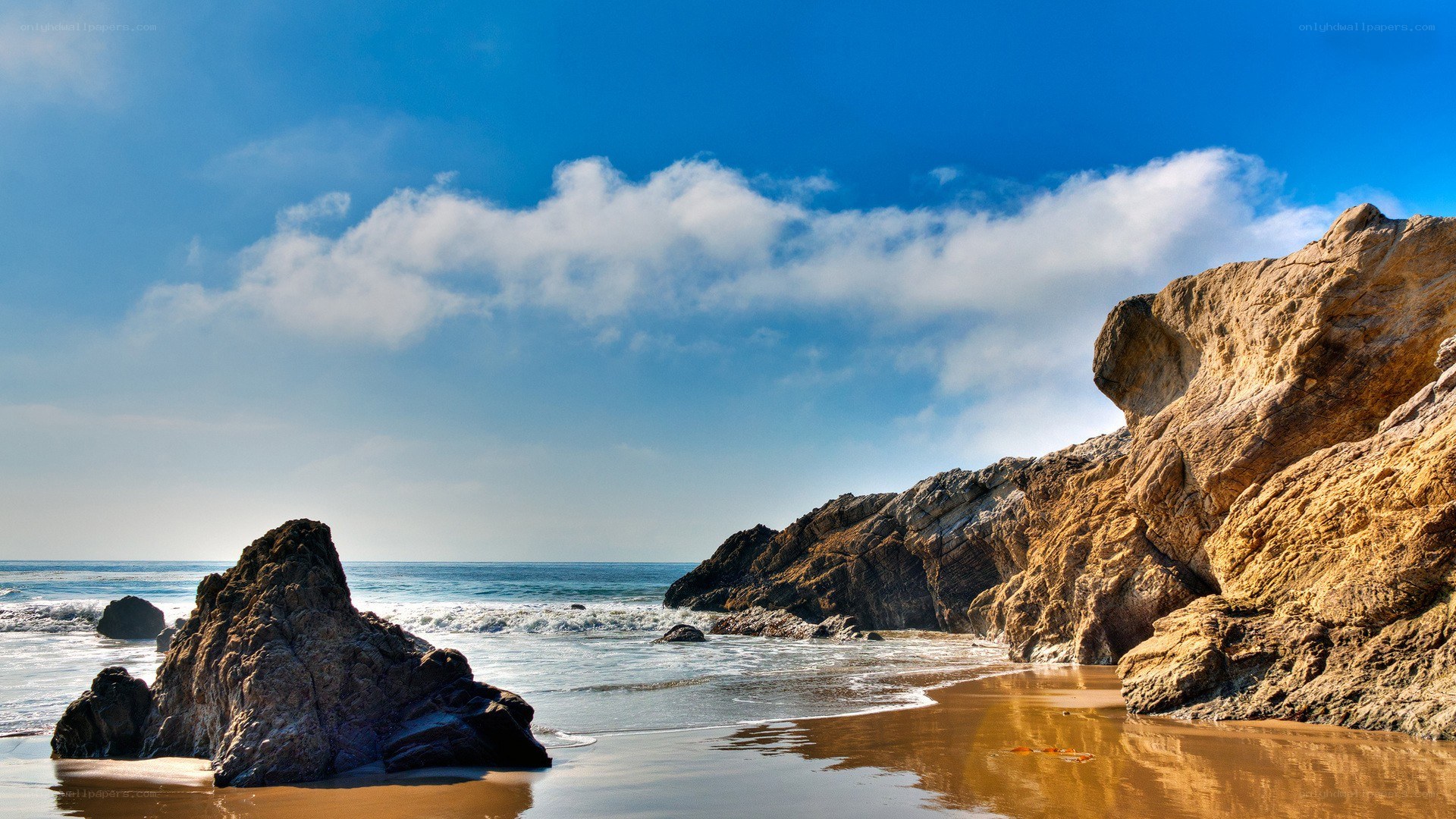 Rocky beach under blue sky