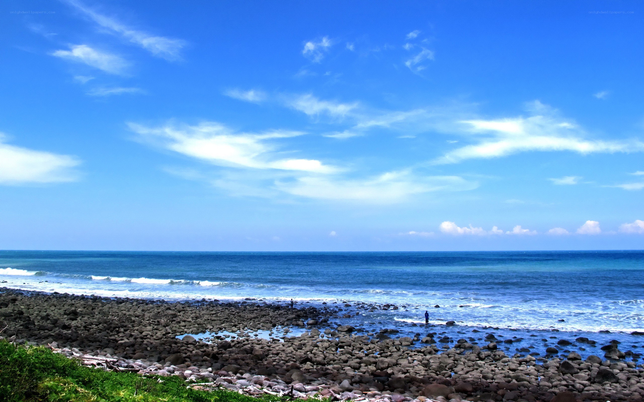 Rocky beach under blue sky