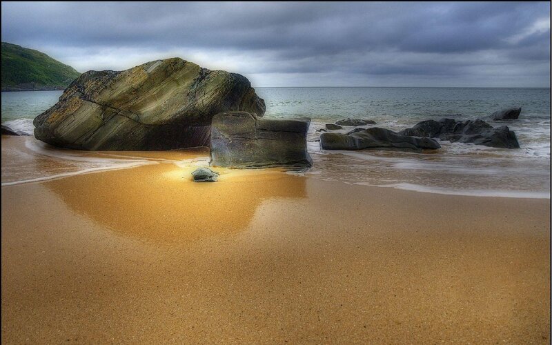 Rocky beach under cloudy sky