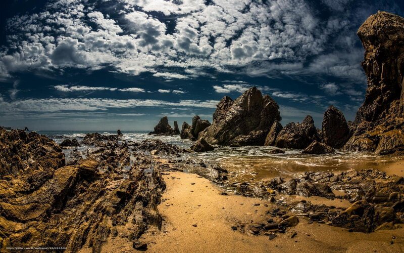 Rocky beach under cloudy sky