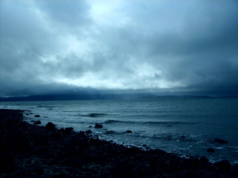 Rocky Beach under Storm Clouds — Blue