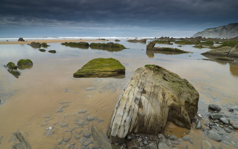 Rocky beach under stormy sky