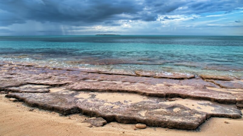 Rocky beach under stormy sky