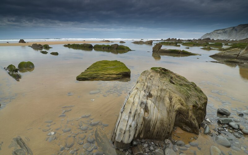 Rocky beach under stormy sky