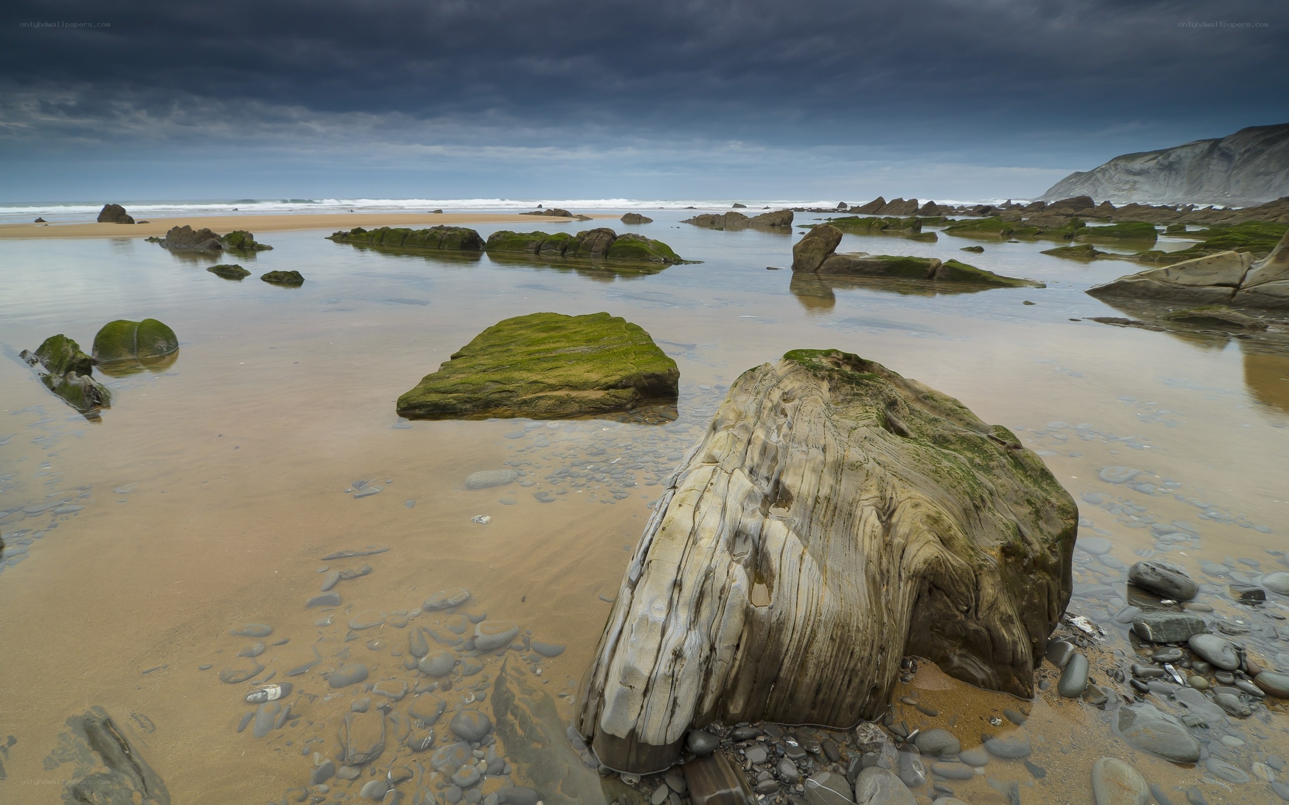 Rocky beach under stormy sky