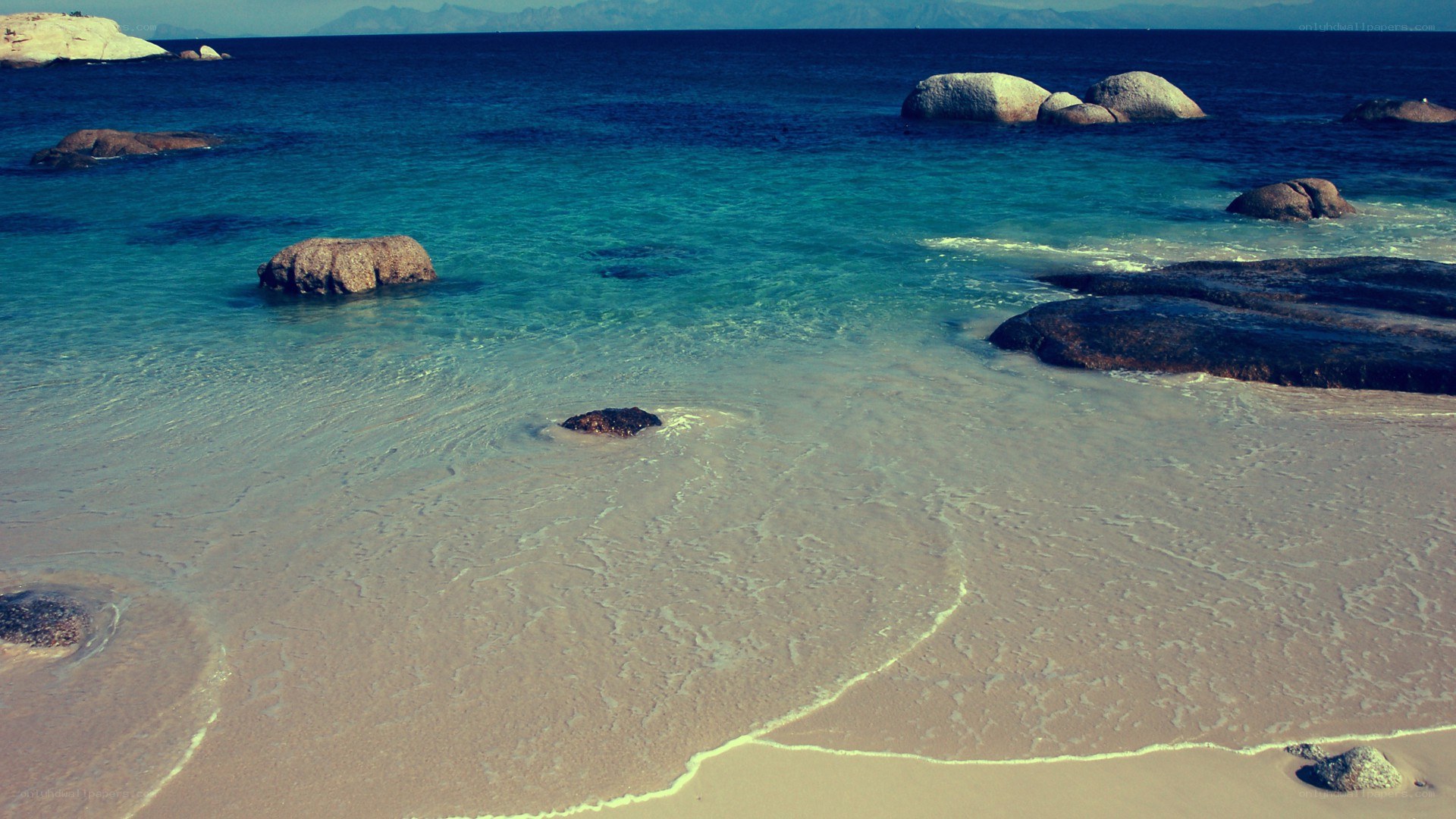 rocky beach with clear water