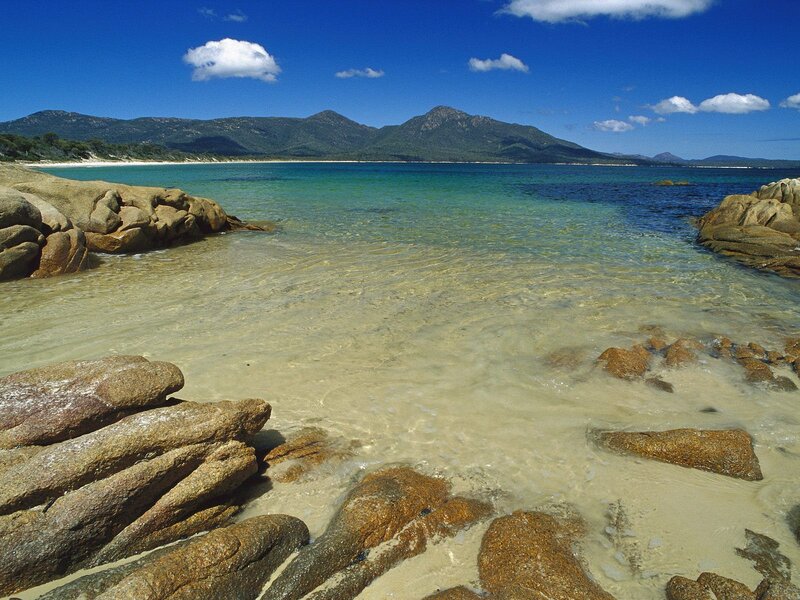 Rocky Beach with Clear Water — Blue