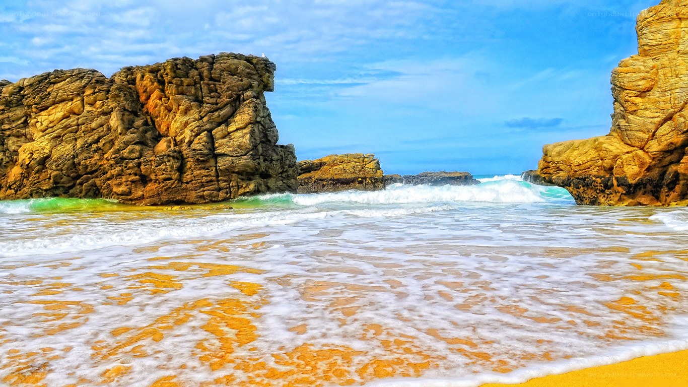 Rocky beach with crashing waves