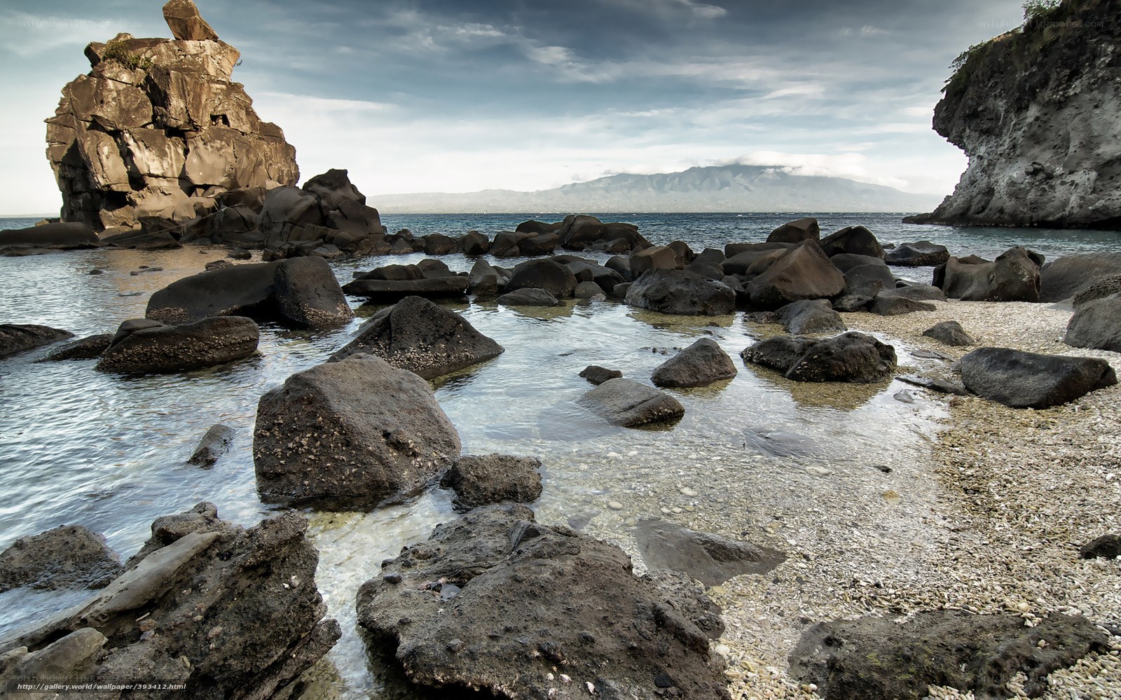 Rocky beach with distant island