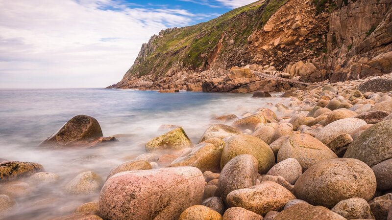 Rocky Beach with Ocean — Blue, Serene, Afternoon, Photograph, Cliff