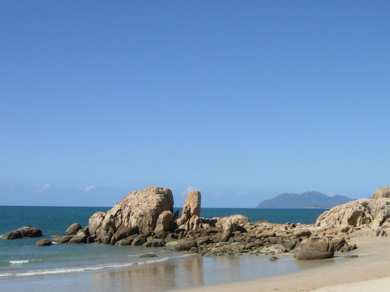 Rocky Beach with Ocean — Blue, Serene, Afternoon, Photograph, Rocks, Mountain