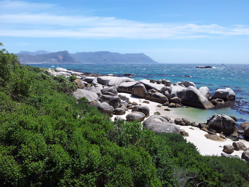 Rocky Beach with Ocean — Blue, Serene, Afternoon, Photograph, Rocks, Mountains